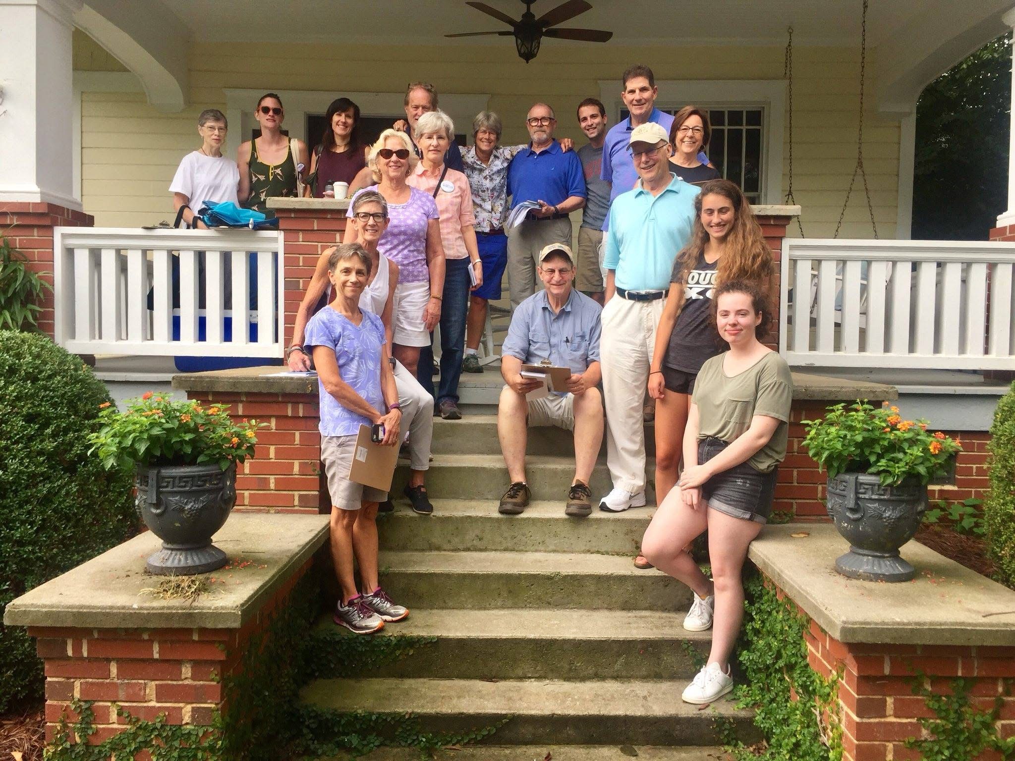 Dems of Davidson community members gathered on a front porch