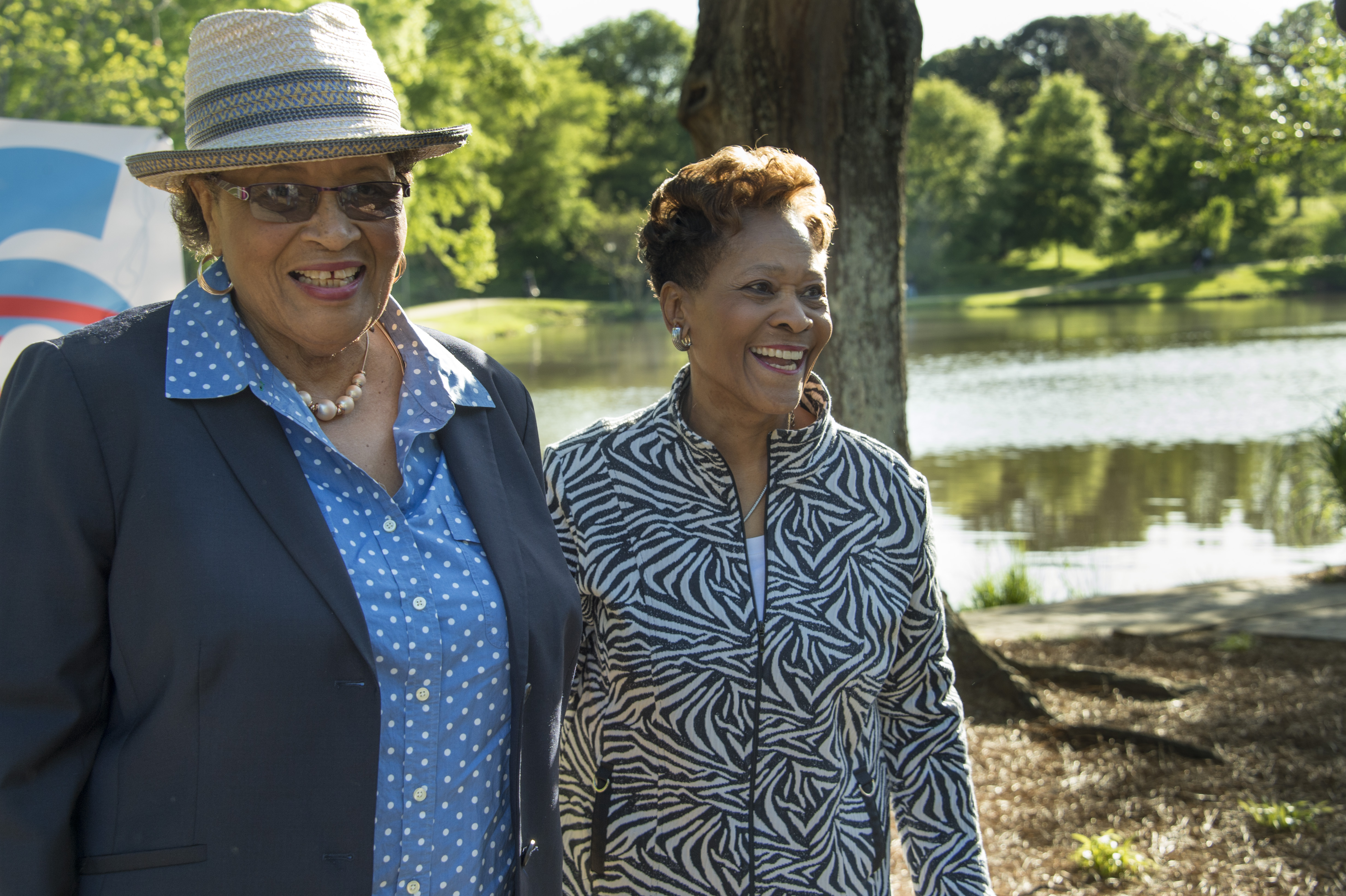 Two women laughing together by Lake Norman